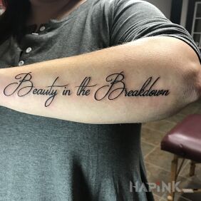 Tattoo Beauty in division on the forearm motif: lettering style: calligraphy