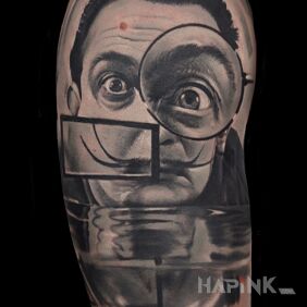 Tattoo Salvador Dali on the upper arm motif: faces style: realistic