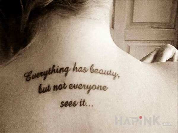Tattoo Sentencja in lettering motif on the back
