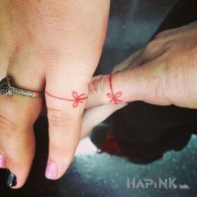 Tattoo For lovers on the fingers motif: Love