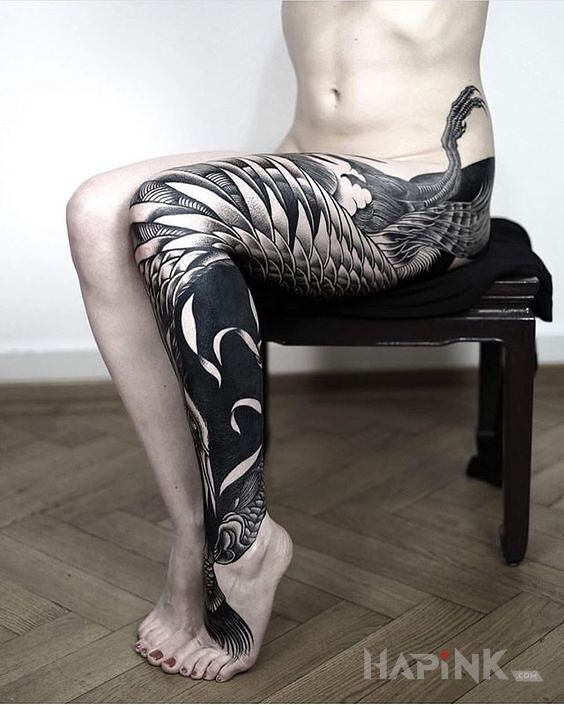 Tattoo Ptaszysko na nodze in black and gray motif and blackwork / blackout style on the calf