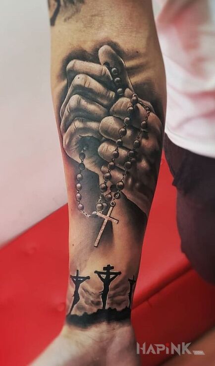 Tattoo Różaniec in 3D motif and realistic style on the forearm