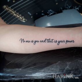 Tattoo No one is you on the forearm motif: lettering style: calligraphy