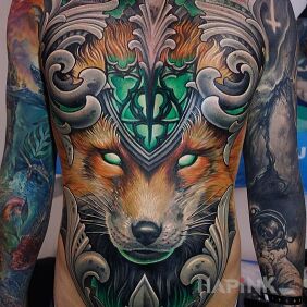 Tattoo Monumental fox on the upper arm motif: colorful style: surrealistic