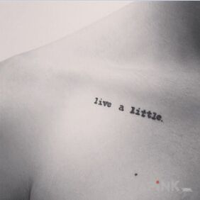 Tattoo Live a little on the collarbone motif: lettering
