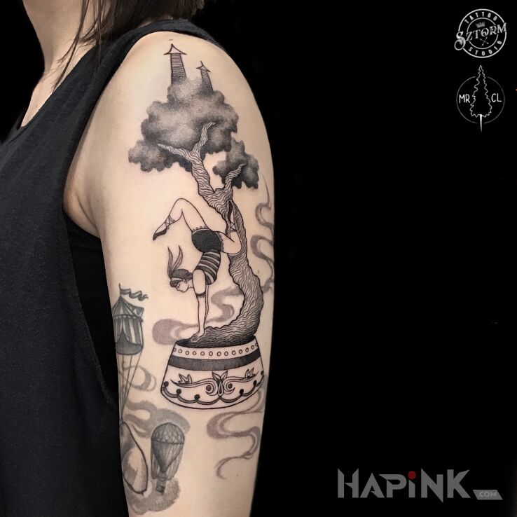 Tattoo Akrobatka in characters motif and graphic / illustrative style on the upper arm