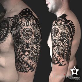 Tattoo Polynesian Tattoo on the upper arm motif: black and gray style: Polynesian