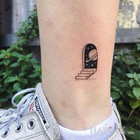 Tattoo Gateway near the ankle motif: cosmos style: minimalistic