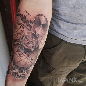 Tattoo Compass and map on the forearm motif: 3D style: realistic