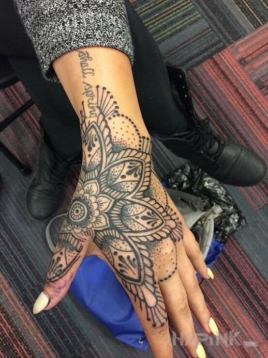 Tattoo Mandala in mandalas motif and graphic / illustrative style on the wrist