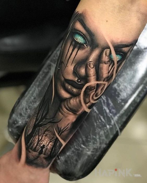 Tattoo Niebieskie gały in demons motif and realistic style on the forearm