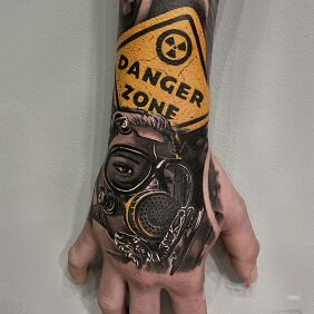 Tattoo Gas mask on the forearm motif: war style: realistic