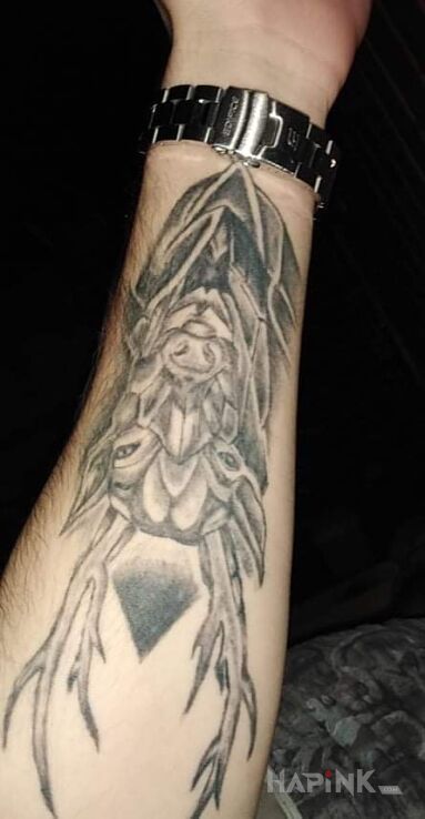 Tattoo Świat wolności in black and gray motif and graphic / illustrative style on the forearm