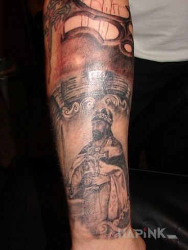 Tattoo Mieszko I in characters motif on the forearm