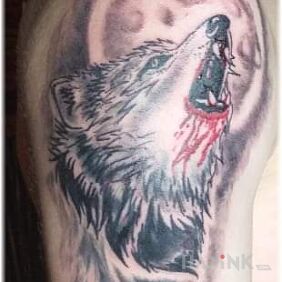 Tattoo Wilczek on the upper arm motif: black and gray style: graphic / illustrative