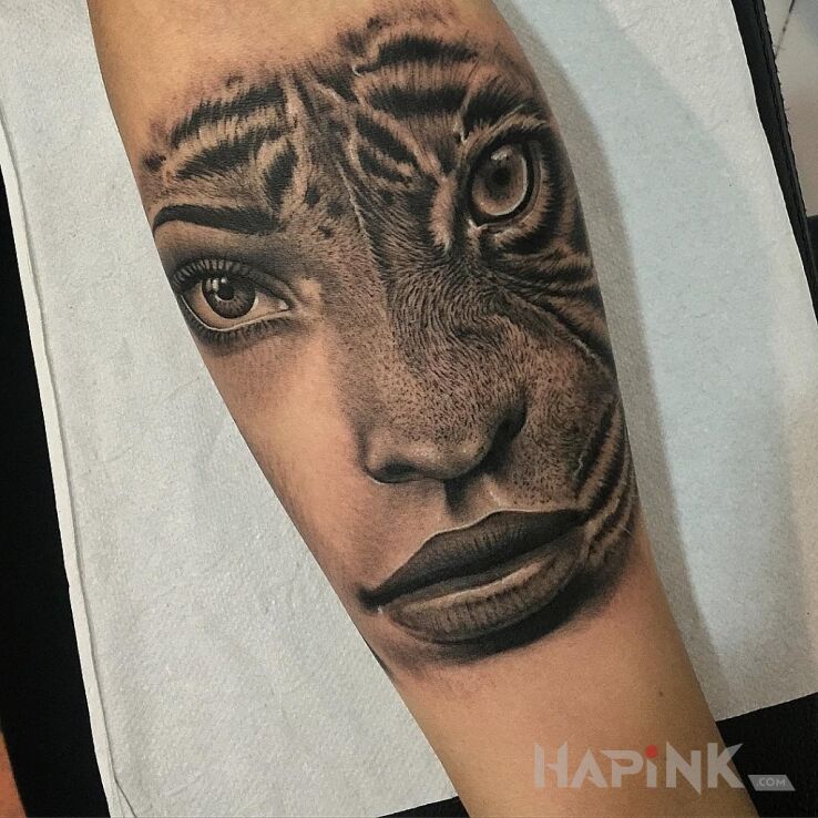 Tattoo Pół kobieta, pół kot in characters motif on the forearm