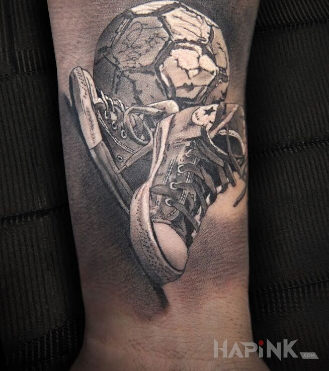 Tattoo Chodź na boisko! in objects motif and realistic style on the forearm