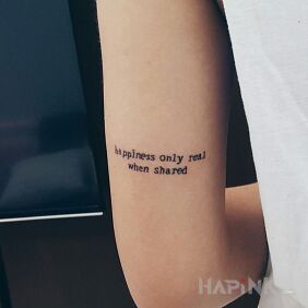 Tattoo Something about happiness on the upper arm motif: lettering