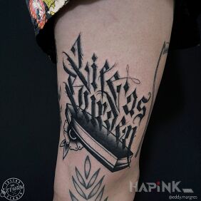 Tattoo Life as burden on the leg motif: criminal lettering
