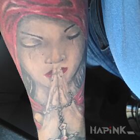 Tattoo Prayer on the forearm motif: religious style: realistic