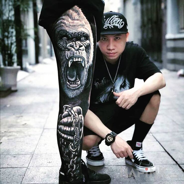 Tattoo Gorilla in animals motif and realistic style on the calf