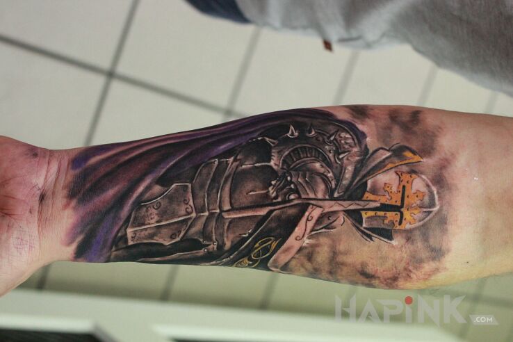 Tattoo Wojownik in characters motif on the forearm