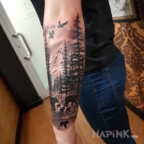Tattoo Forest with bears on the forearm motif: black and gray style: realistic