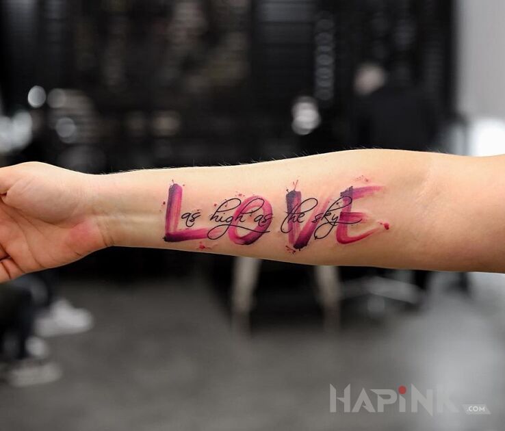 Tattoo Love in lettering motif and Watercolor style on the forearm