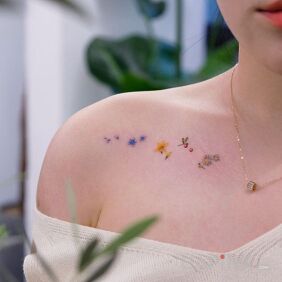 Tattoo A few different flowers on the collarbone motif: flowers style: minimalistic