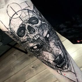 Tattoo The skull and the wolf on the forearm motif: skulls
