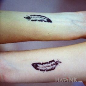 Tattoo Feathers two on the forearm motif: Love