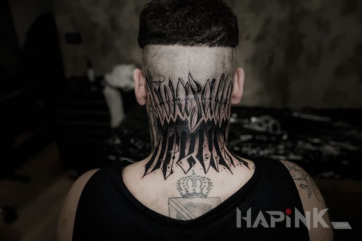 Tattoo Kaligrafia in lettering motif on the nape