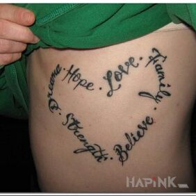 Tattoo Important values on the ribs motif: lettering