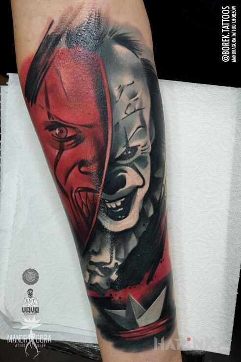 Tattoo Pennywise in demons motif and realistic style on the forearm