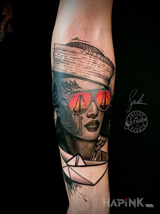 Tattoo Stocznia in colorful motif and graphic / illustrative style on the forearm