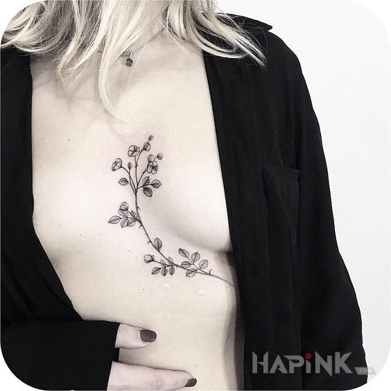 Tattoo Gałązka in flowers motif and graphic / illustrative style on the chest