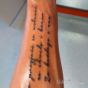 Tattoo Life principles on the forearm motif: lettering style: calligraphy
