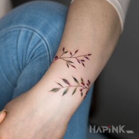 Tattoo Twigs around the forearm on the wrist motif: flowers style: minimalistic