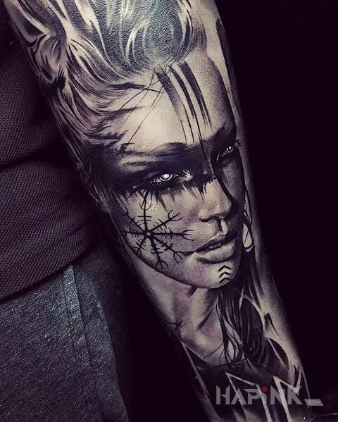 Tattoo Nordycka kobieta in faces motif and realistic style on the forearm