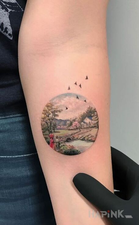 Tattoo Mini krajobraz in colorful motif and graphic / illustrative style on the forearm
