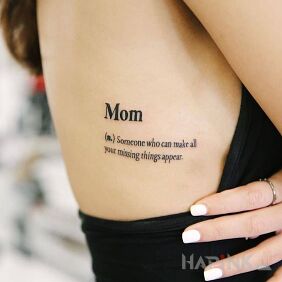Tattoo Mom on the ribs motif: lettering style: calligraphy