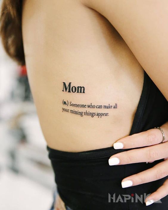Tattoo Mama in lettering motif and calligraphy style on the ribs