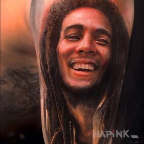 Tattoo Bob Marley on the upper arm motif: characters