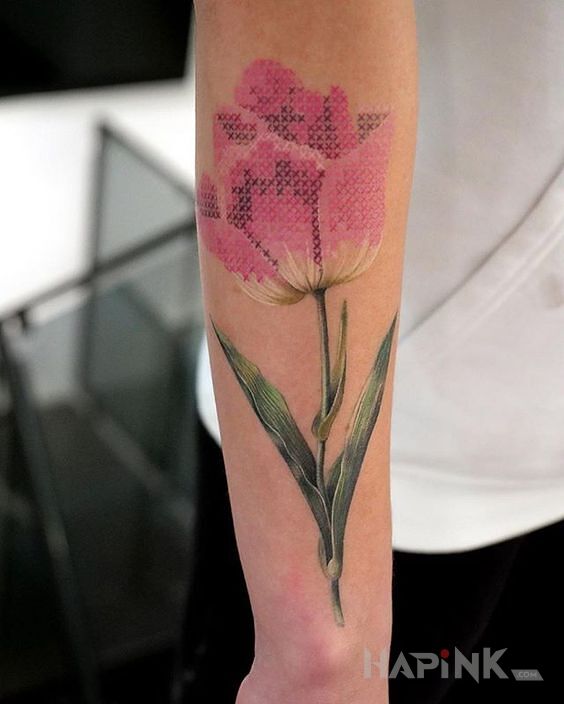 Tattoo Haftowana róża in flowers motif and embroidered style on the forearm
