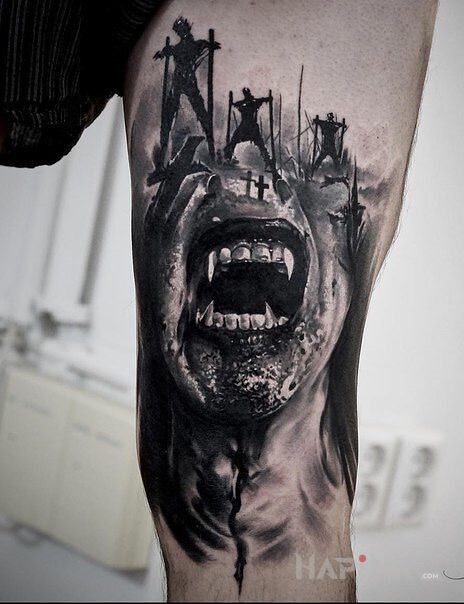 Tattoo Wampirze zęby in black and gray motif and realistic style on the upper arm