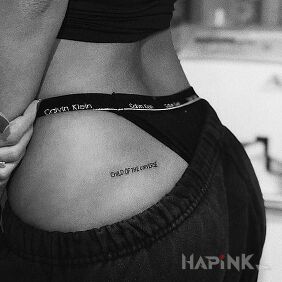 Tattoo Child of the universe on the buttocks motif: lettering style: calligraphy