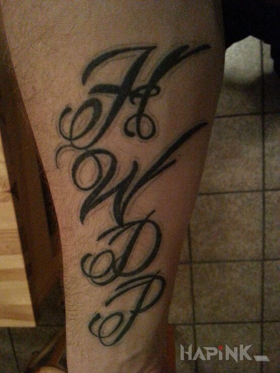 Tattoo HWDP in lettering motif on the wrist