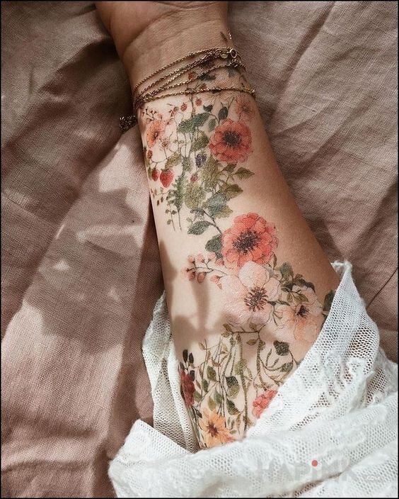 Tattoo Retro kwiaty in flowers motif and realistic style on the forearm