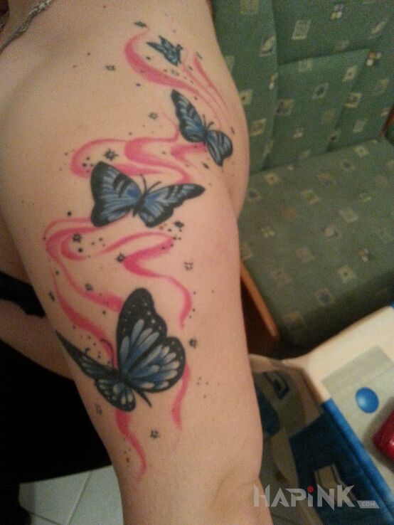 Tattoo Motyle in butterflies motif on the shoulder blades