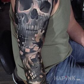 Tattoo Puzzled skull on the upper arm motif: 3D style: realistic
